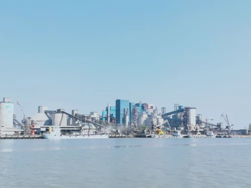 View of an industrial harbor with modern architecture and shipment activities in Bangladesh.